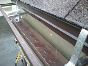 A roof with gutters attached to it in Erie, PA.